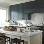 CALACATTA ISLAND WITH DARK CABINETS